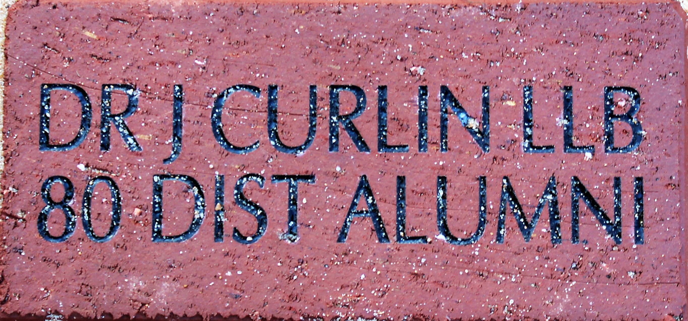 DR J CURLIN LLB 80 DIST ALUMNI